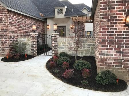 Finished custom home exterior, stucco and brick